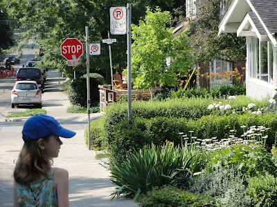 girls walking discovering little free library