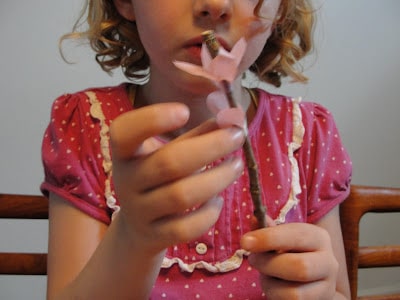 child making cherry blossom branch