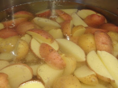 quartered potatoes boiling