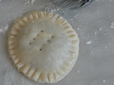 pressing crust closed with fork