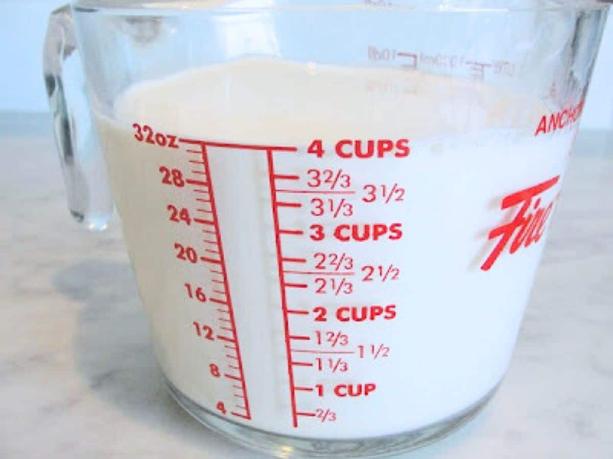 4 cups of milk in a measuring cup