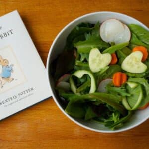 bowl of peter rabbit salad with peter rabbit book