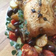 greek roasted chicken on platter