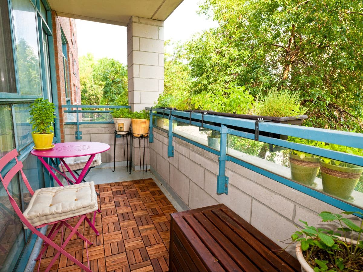 image of a balcony with table and some plants