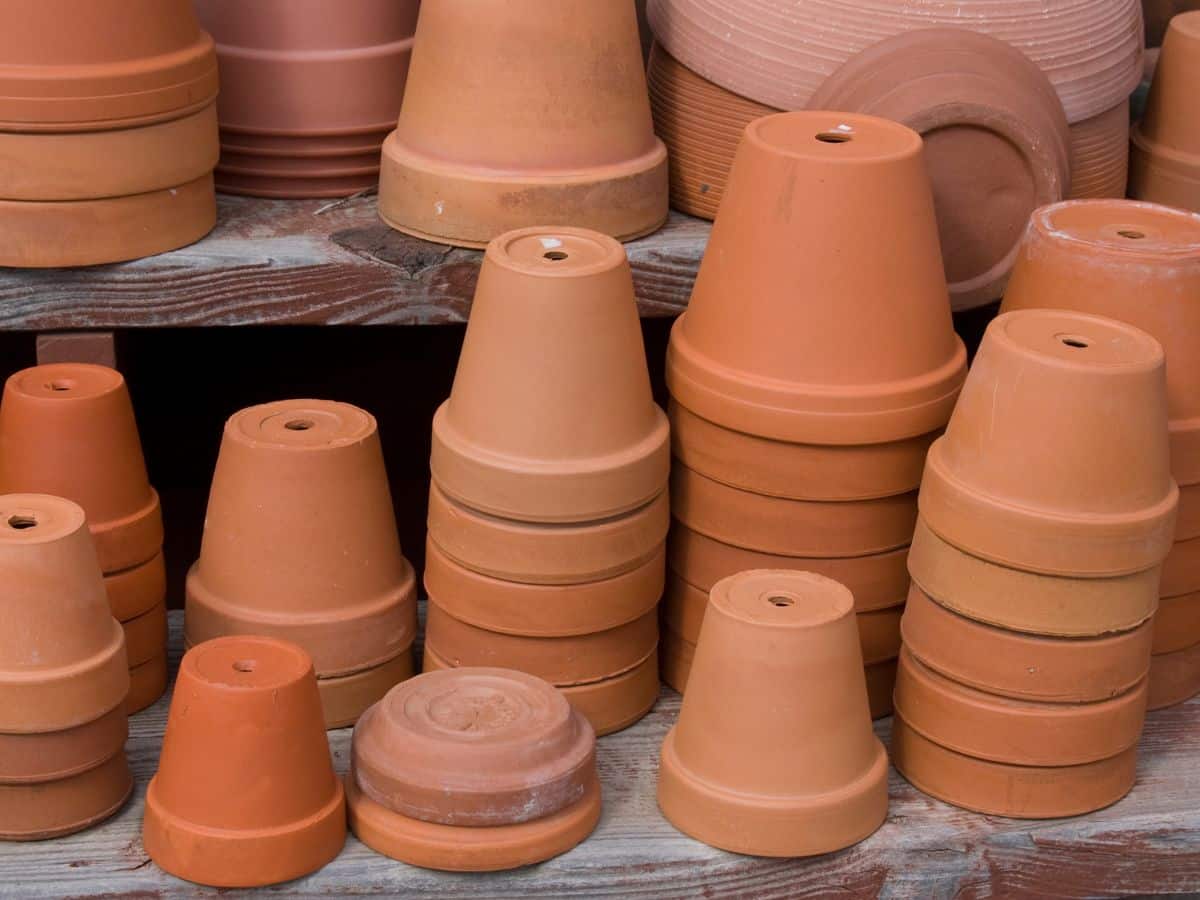 pile of terracotta pots with drainage holes