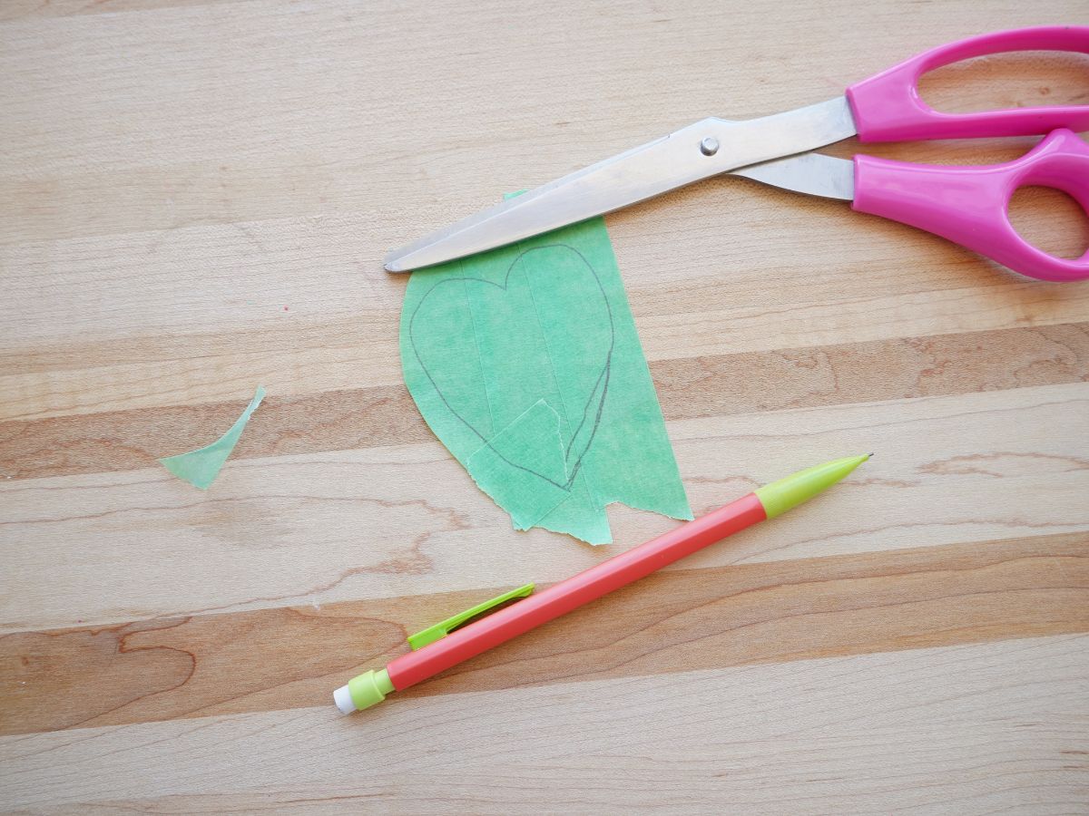 painter's tape in shape of heart with pencil and scissors