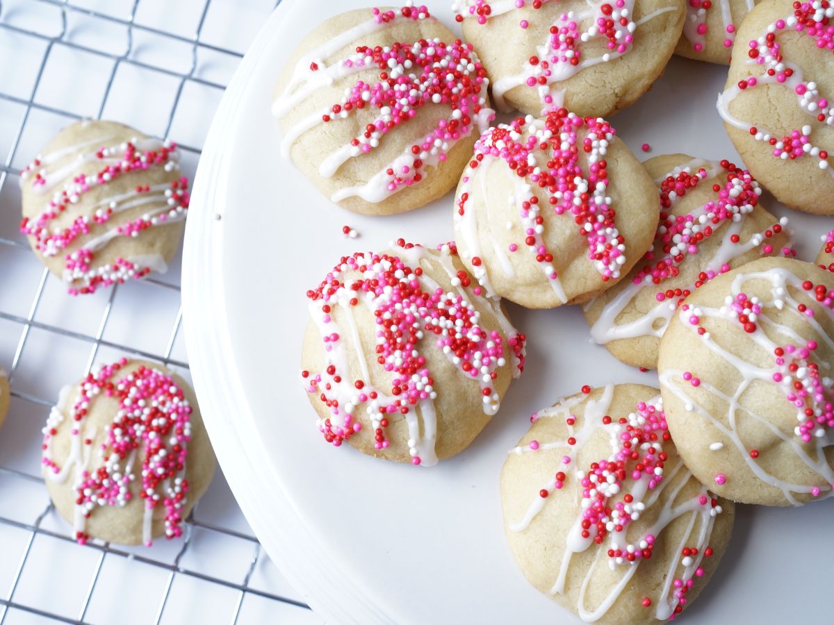 finished chocolate kiss filled cookies on cooling rack and on plate