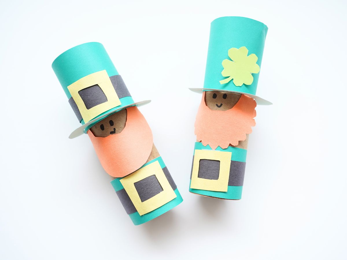 2 toilet paper roll leprechauns laying on their backs