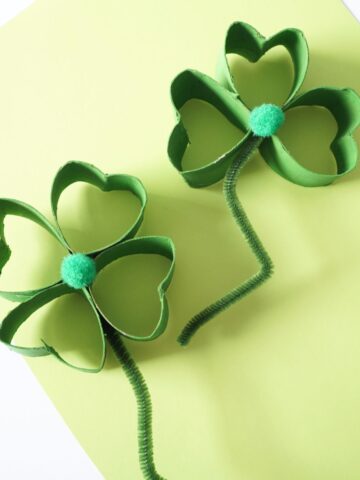 2 toilet roll green shamrocks with pompom middles and pipe cleaner stems featured