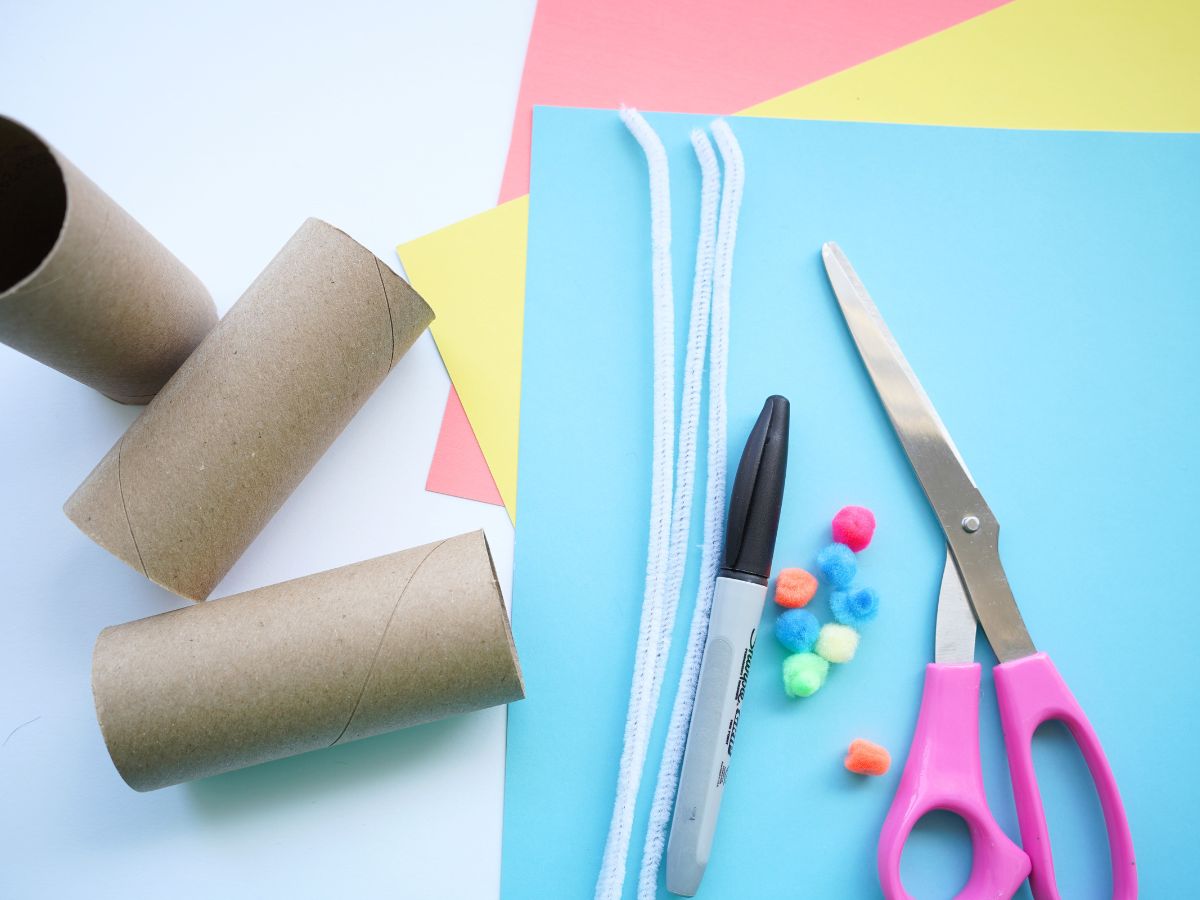 supplies to make toilet roll Easter baskets - paper, marker, scissors, pompoms